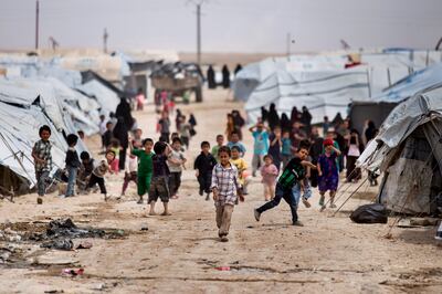 Children gather outside their tents in Al Hol camp in Syria. AP