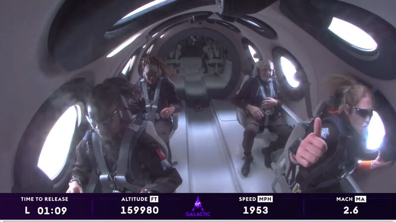 The three paying passengers and Virgin Galactic's chief astronaut instructor inside the cabin during the space tourism flight.