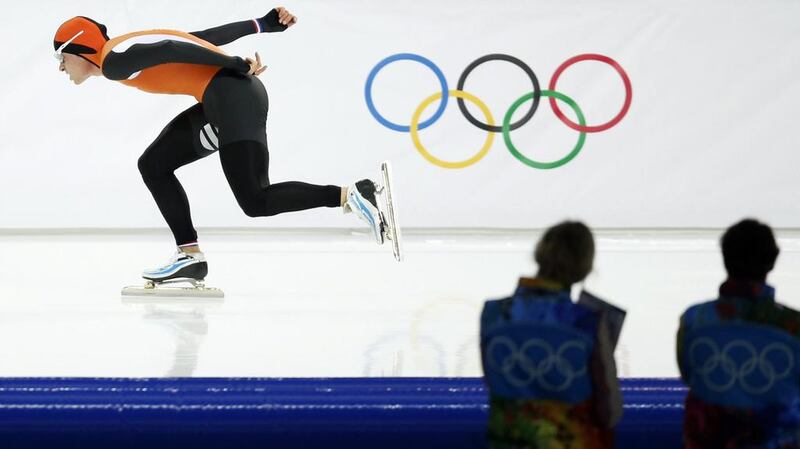Silver medallist Koen Verweij of the Netherlands competes in the men's 1,500-meter speedskating race on Saturday. Verweij lost the gold medal by three thousandth of a second. Pavel Golovkin / AP