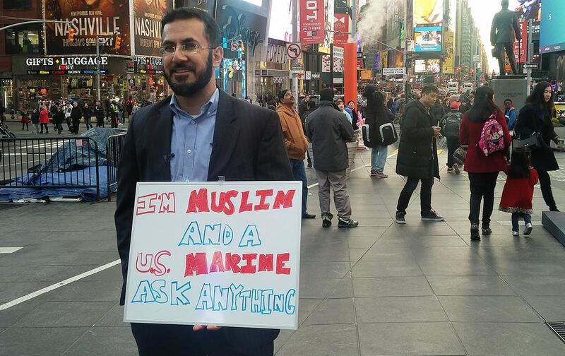 Mansoor Shams, a Muslim who served in the US Marines, brings his "ask anything" campaign to New York's Times Square. Rob Crilly / The National)