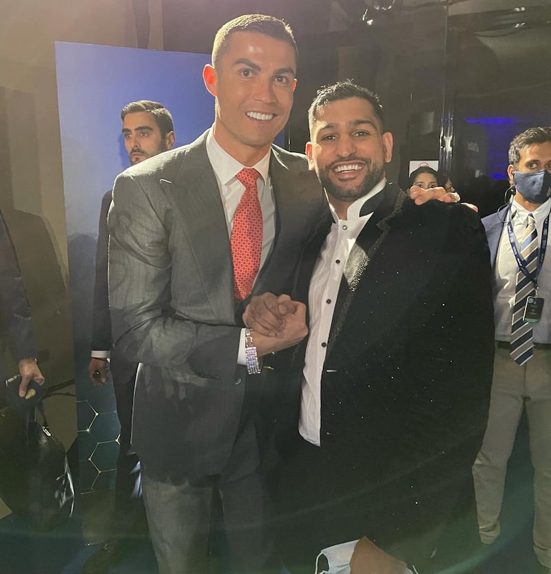 Amir Khan attends the 2020 Dubai Globe Soccer Awards with footballer Cristiano Ronaldo in December 2020. Instagram / Amir Khan 