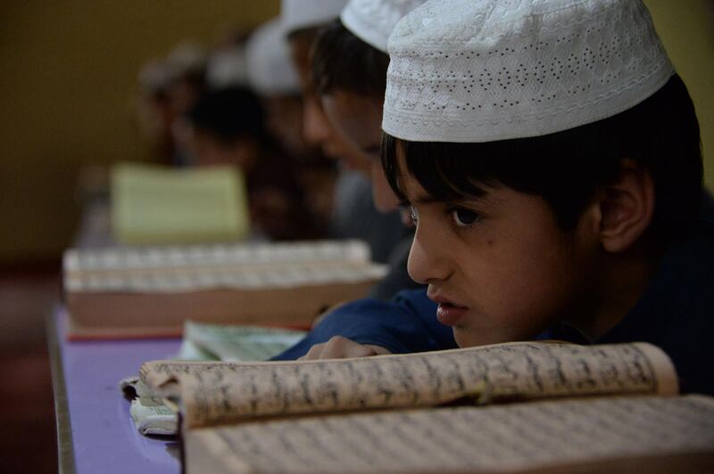 Afghan boys read the Quran during the Islamic holy month of Ramadan at a mosque in Kabul, Afghanistan, on May 17, 2018. Noorullah Shirzada / AFP Photo