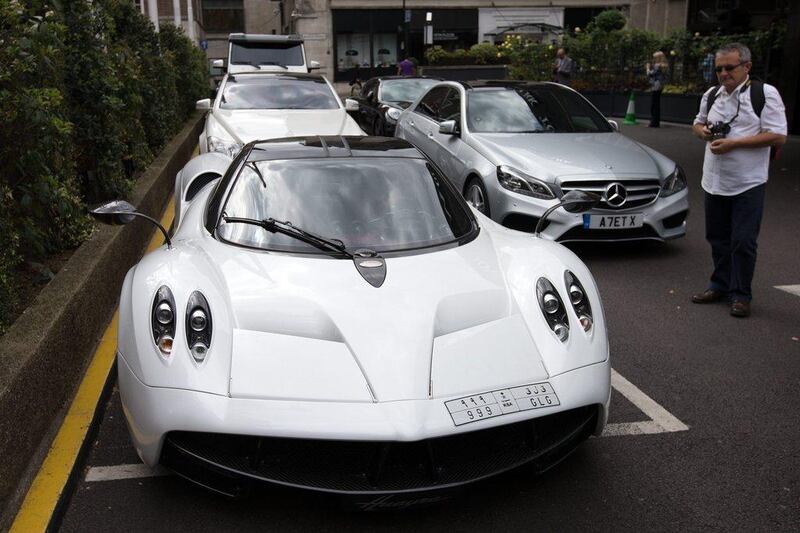 An admirer views a A Saudi Arabian registered Pagani Huayra. Carl Court / Getty Images