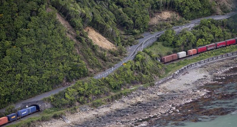 A freight train is seen trapped by landslides in the area north of Kaikoura. Mark Mitchell / New Zealand Herald Pool Photo via AP