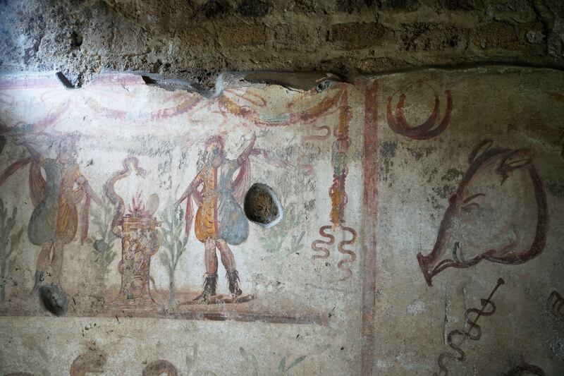 A fresco is seen inside the kitchen of a house at the Pompeii archaeological site in southern Italy, Tuesday, Feb.  15, 2022.  In a few horrible hours, Pompeii went from being a vibrant city to a dead one, smothered by a furious volcanic eruption in 79 AD.  Then in this century, Pompeii appeared alarmingly on the precipice of a second death, assailed by decades of neglect, mismanagement and scanty systematic maintenance of heavily visited ruins.  (AP Photo / Gregorio Borgia)