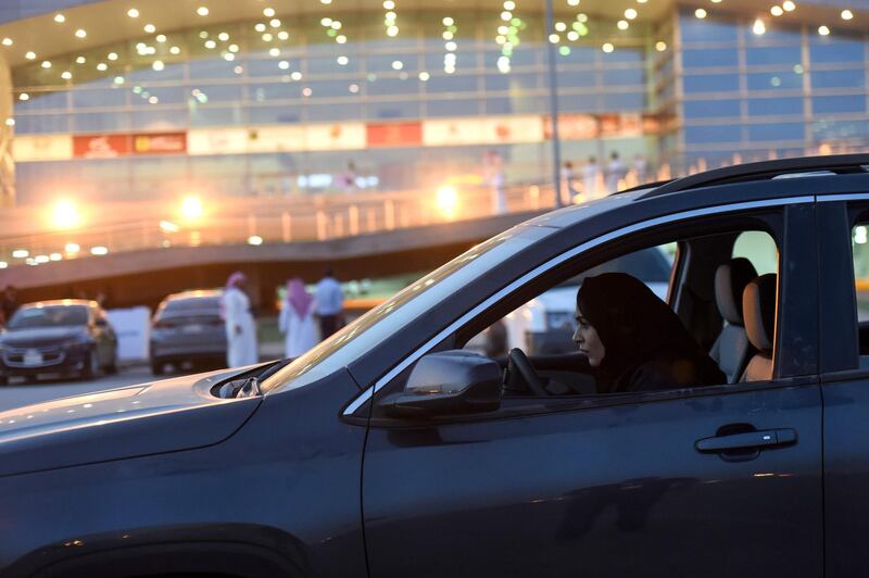 (FILES) In this file photo taken on May 13, 2018, a Saudi woman test-drives a car during an automotive exhibition for women in the capital Riyadh. Saudi Arabia, the only country that does not allow women to drive, is set to lift its ban on female motorists on June 24. / AFP / FAYEZ NURELDINE
