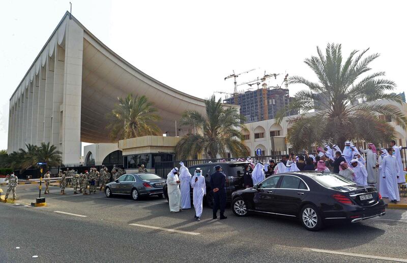 Kuwaiti opposition MPs gather outside the parliament building in Kuwait City. AFP