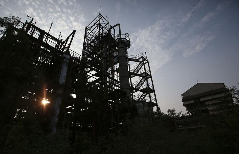 The sun sets behind the abandoned former Union Carbide pesticide plant in Bhopal.