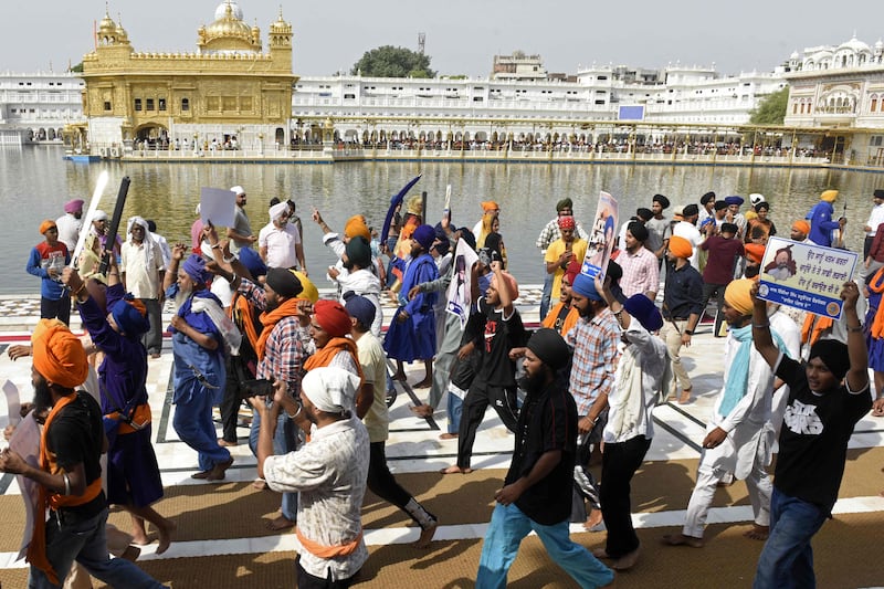 Activists from various Sikh organisations after offering prayers at the Golden Temple on the 38th anniversary of Operation Blue Star on June 6, 2022.  AFP