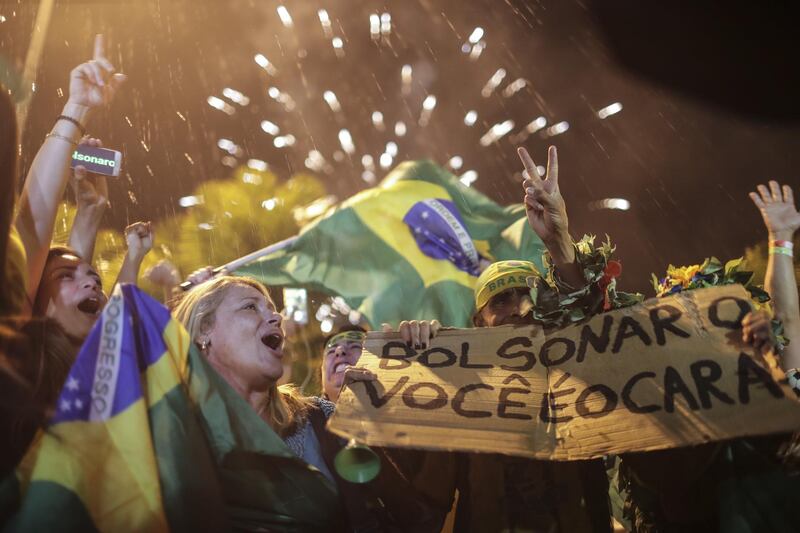 Supporters of Brazilian far-right presidential candidate Jair Bolsonaro celebrate in Rio de Janeiro. EPA