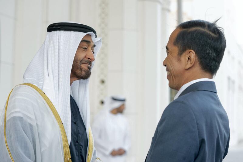 ABU DHABI, UNITED ARAB EMIRATES - January 12, 2020: HH Sheikh Mohamed bin Zayed Al Nahyan, Crown Prince of Abu Dhabi and Deputy Supreme Commander of the UAE Armed Forces (L), receives HE Joko Widodo, President of Indonesia (R), upon his arrival at Qasr Al Watan.

( Mohamed Al Hammadi / Ministry of Presidential Affairs )
---