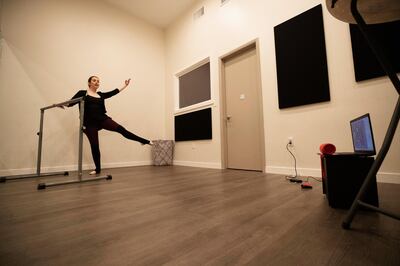 Dance instructor Anneliese Suda teaches a pre-teen junior company ballet class through Zoom at Sierra Madre Dance Center, which is closed during the global outbreak of the coronavirus disease (COVID-19), in Sierra Madre, California, U.S., April 1, 2020. REUTERS/Mario Anzuoni