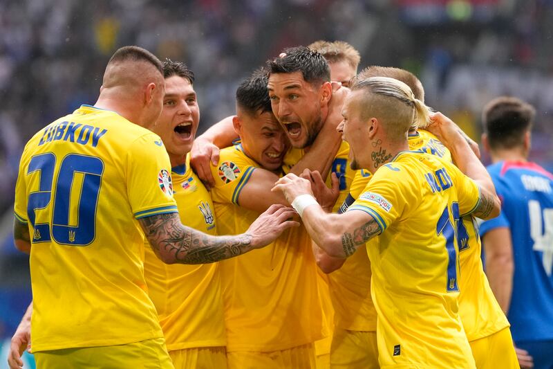 Ukraine's Roman Yaremchuk celebrates after scoring his side's second goal during their Euro Group E match against Slovakia in Duesseldorf, Germany, on Friday, June 21, 2024. AP