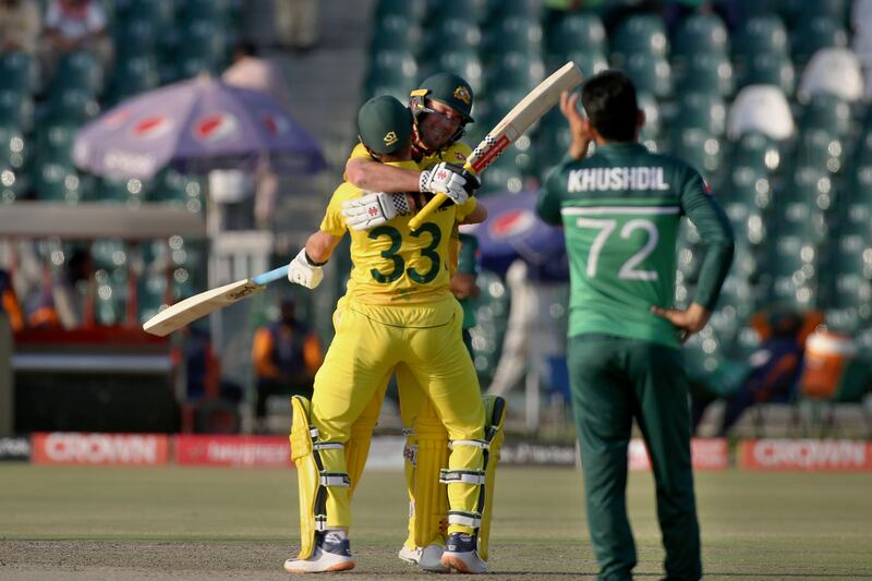 Australia's Ben McDermott celebrates his century with teammate Marnus Labuschagne. AP