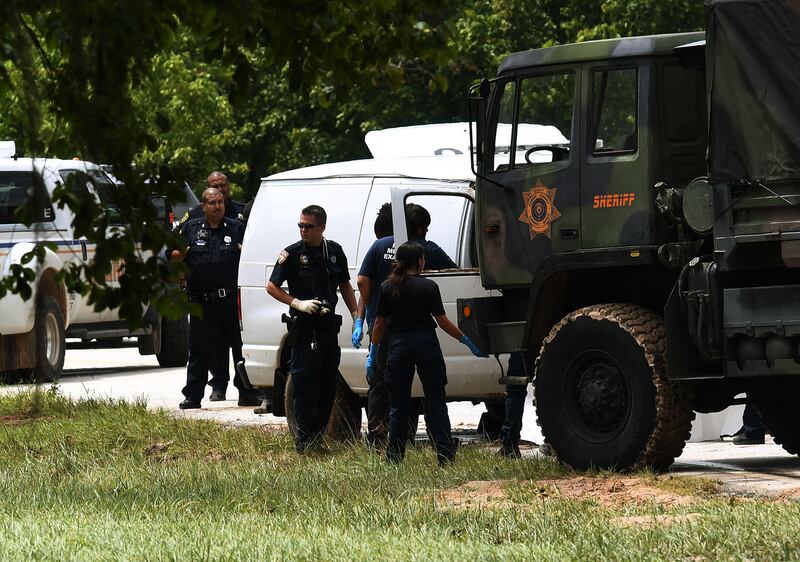 Police investigators check the van containing the six members of the the Saldivar family who died after they crashed their van into Greens Bayou, trying tried to flee Hurricane Harvey during heavy flooding in Houston, Texas on August 30, 2017.
Hurricane Harvey hit the Texas coast with over 3 feet of rain and 125 mph winds. / AFP PHOTO / MARK RALSTON