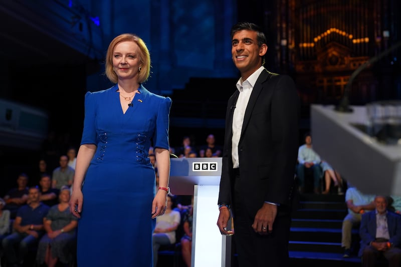 Ms Truss and Mr Sunak pose for a picture before a BBC leadership debate at Victoria Hall in Hanley. Getty