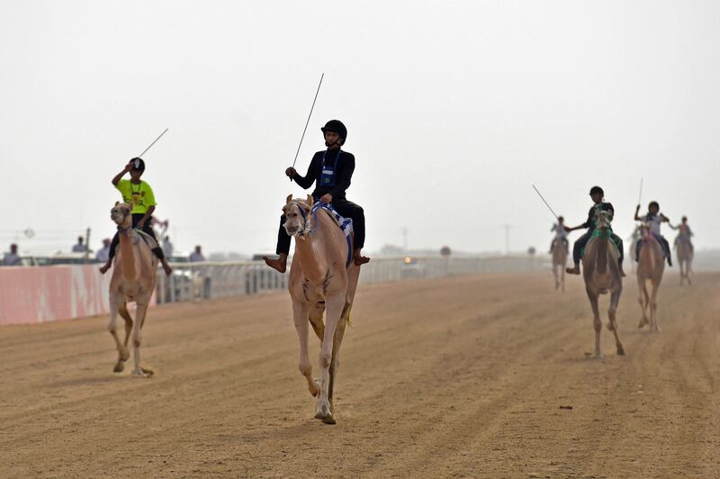 Riders take part in the race.