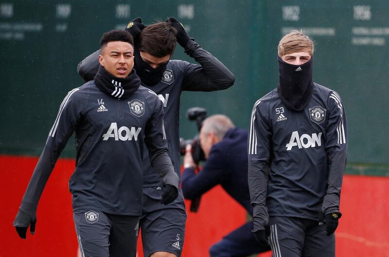 Soccer Football - Europa League - Manchester United Training - Aon Training Complex, Manchester, Britain - February 19, 2020   Manchester United's Jesse Lingard, Brandon Williams and Harry Maguire during training   Action Images via Reuters/Craig Brough