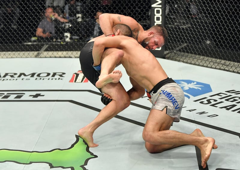 ABU DHABI, UNITED ARAB EMIRATES - JULY 16: (R-L) Khamzat Chimaev of Czechia takes down John Phillips of Wales in their middleweight fight during the UFC Fight Night event inside Flash Forum on UFC Fight Island on July 16, 2020 in Yas Island, Abu Dhabi, United Arab Emirates. (Photo by Jeff Bottari/Zuffa LLC via Getty Images) *** Local Caption *** ABU DHABI, UNITED ARAB EMIRATES - JULY 16: (R-L) Khamzat Chimaev of Czechia takes down John Phillips of Wales in their middleweight fight during the UFC Fight Night event inside Flash Forum on UFC Fight Island on July 16, 2020 in Yas Island, Abu Dhabi, United Arab Emirates. (Photo by Jeff Bottari/Zuffa LLC via Getty Images)