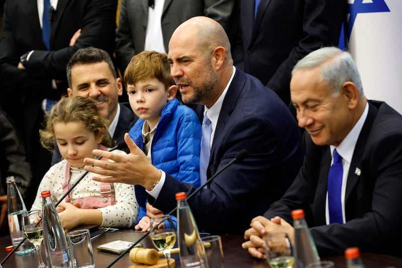 New Knesset speaker Amir Ohana, centre, with his partner Alon, left, their children, and Benjamin Netanyahu at the Knesset in Jerusalem. AFP