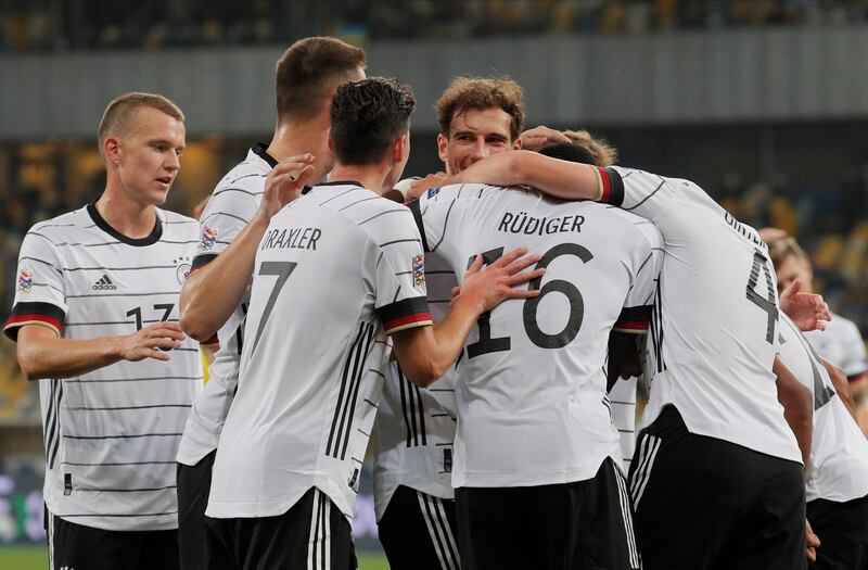 Germany's Matthias Ginter celebrates teammates after scoring the opening goal against Ukraine. EPA