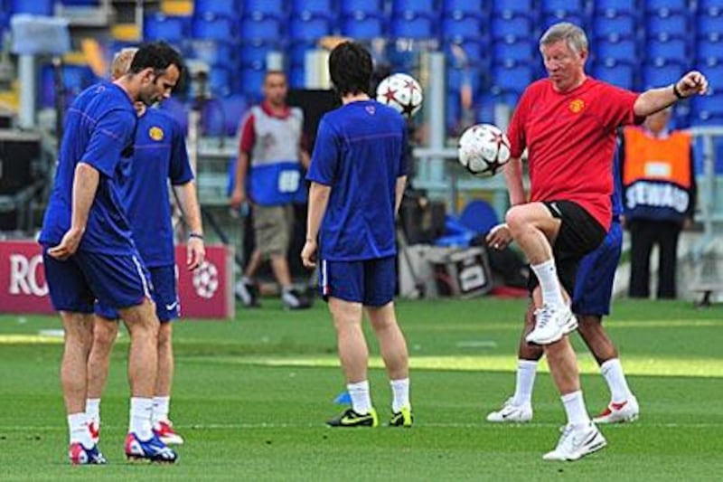 Sir Alex Ferguson, right, retired as Manchester United manager at the age of 71.