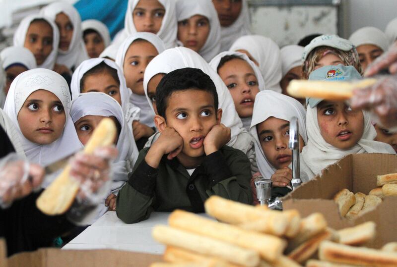Yemeni students wait to get free food from a local charity at a school in Sanaa, Yemen February 19, 2019. REUTERS/Mohamed al-Sayaghi