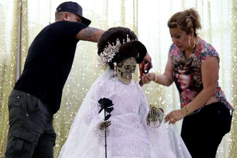 Altar to the image of Santa Muerte, to which members of the large Mexican community offer prayers and devotion during a procession in Queens, New York City. AFP