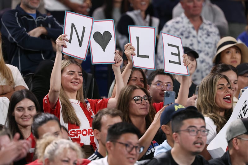 Novak Djokovic fans hold up a sign in support during his match against Adrian Mannarino. AFP