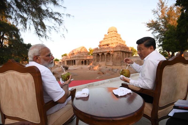 Prime Minister Narendra Modi and President Xi Jinping at the 'five chariots' monument in Mamallapuram. EPA
