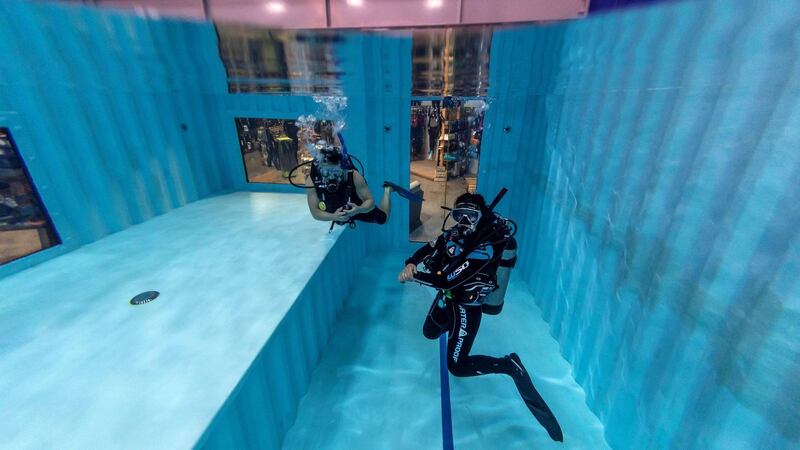 DUBAI, UNITED ARAB EMIRATES. 07 MARCH 2021.   Michela Colella, Dive Instructor, conducts a training session with a learner diver in the newly opened indoor pool at the Dive Garage facility in Al Quoz 4. The pool is constructed out of shipping containers and hols a 100 000 liters of fresh water, making it one of a kind in the Middle East. (Photo: Antonie Robertson/The National) Journalist: Janice Rodriques. Section: National.