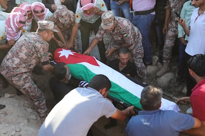 epa06946138 People carry the body of the anti-terrorist unit Sergeant Hisham Aqarbeh, who was killed in duty during a police operation in Salt, during his funeral in Birayn, governorate of Zarqa, some 30 kms North East of Amman, Jordan, 12 August 2018. Jordanian Security forces stormed a building on 11 August evening in the city of Salt, where men suspected of planting the home-made bomb that killed one policeman on 10 August were believed to be hiding. After an exchange of fire, an explosion rocked the building and brought it down, according to the Government spokeswoman Jumana Ghuneimat, the explosion occurred as the alleged terrorists had rigged the building with explosives and detonated then during the police raid. The operation continued well into 12 August morning and resulted in the arrest of five people, death of three members of the security forces and the injury of more than a dozen others.  EPA/ANDRE PAIN