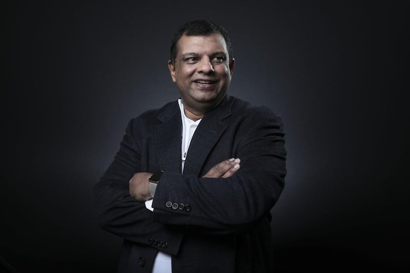 Tony Fernandes, chief executive officer of AirAsia Bhd., poses for a photograph following a Bloomberg Television interview on the opening day of the World Economic Forum (WEF) in Davos, Switzerland, on Tuesday, Jan. 23, 2018. World leaders, influential executives, bankers and policy makers attend the 48th annual meeting of the World Economic Forum in Davos from Jan. 23 - 26. Photographer: Simon Dawson/Bloomberg