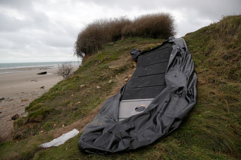 The remains of an inflatable small boat on the shore in Wimereux, northern France, in November 2021. AP Photo