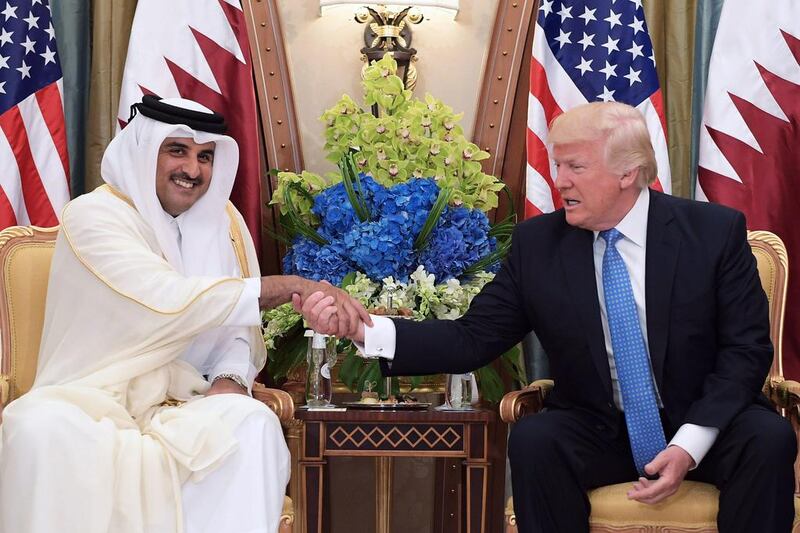 US president Donald Trump, right, and Qatar’s Emir Sheikh Tamim Bin Hamad Al-Thani take part in a bilateral meeting at a hotel in Riyadh on May 21, 2017. Mandel Ngan / AFP
