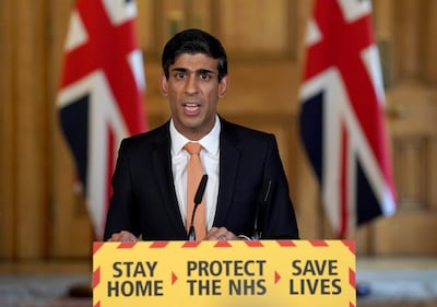 A handout image released by 10 Downing Street, shows Britain's Chancellor of the Exchequer Rishi Sunak speaking during a remote press conference to update the nation on the COVID-19 pandemic, inside 10 Downing Street in central London on April 8, 2020. Britain's Prime Minister Boris Johnson was "responding to treatment", his spokesman said Wednesday, as the 55-year-old leader spent a third day in intensive care battling the coronavirus.
 - RESTRICTED TO EDITORIAL USE - MANDATORY CREDIT "AFP PHOTO / 10 DOWNING STREET / PIPPA FOWLES" - NO MARKETING - NO ADVERTISING CAMPAIGNS - DISTRIBUTED AS A SERVICE TO CLIENTS
 / AFP / 10 Downing Street / Pippa FOWLES / RESTRICTED TO EDITORIAL USE - MANDATORY CREDIT "AFP PHOTO / 10 DOWNING STREET / PIPPA FOWLES" - NO MARKETING - NO ADVERTISING CAMPAIGNS - DISTRIBUTED AS A SERVICE TO CLIENTS
