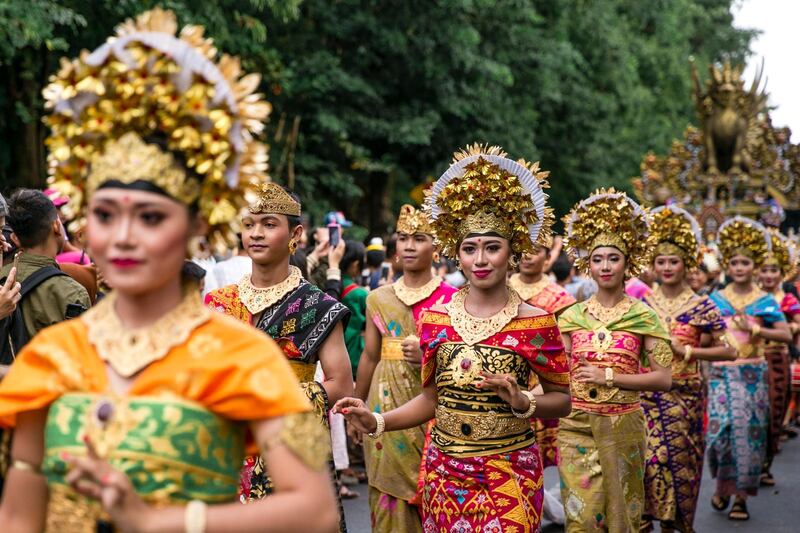 Balinese take part in a parade to mark the opening of the annual Bali Art Festival on a main road in Denpasar, Bali, Indonesia.  Made Nagi / EPA