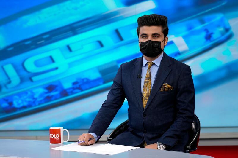 TV anchor Nesar Nabil wears a face mask in protest against the Taliban's order that female presenters in Afghanistan cover their faces. AP
