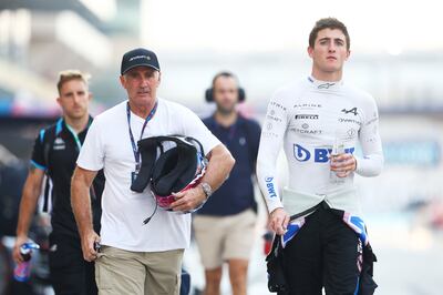 Alpine F1 reserve driver Jack Doohan walks the pit lane of the Yas Marina Circuit. Getty Images