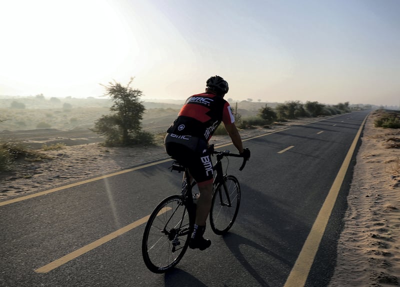 Dubai, United Arab Emirates - October 1st, 2017: Standalone. Cyclists get up early to exercise. Sunday, October 1st, 2017 at Al Qudra Bike Track, Dubai. 