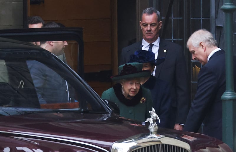Queen Elizabeth and her son Prince Andrew leave after the service. Reuters