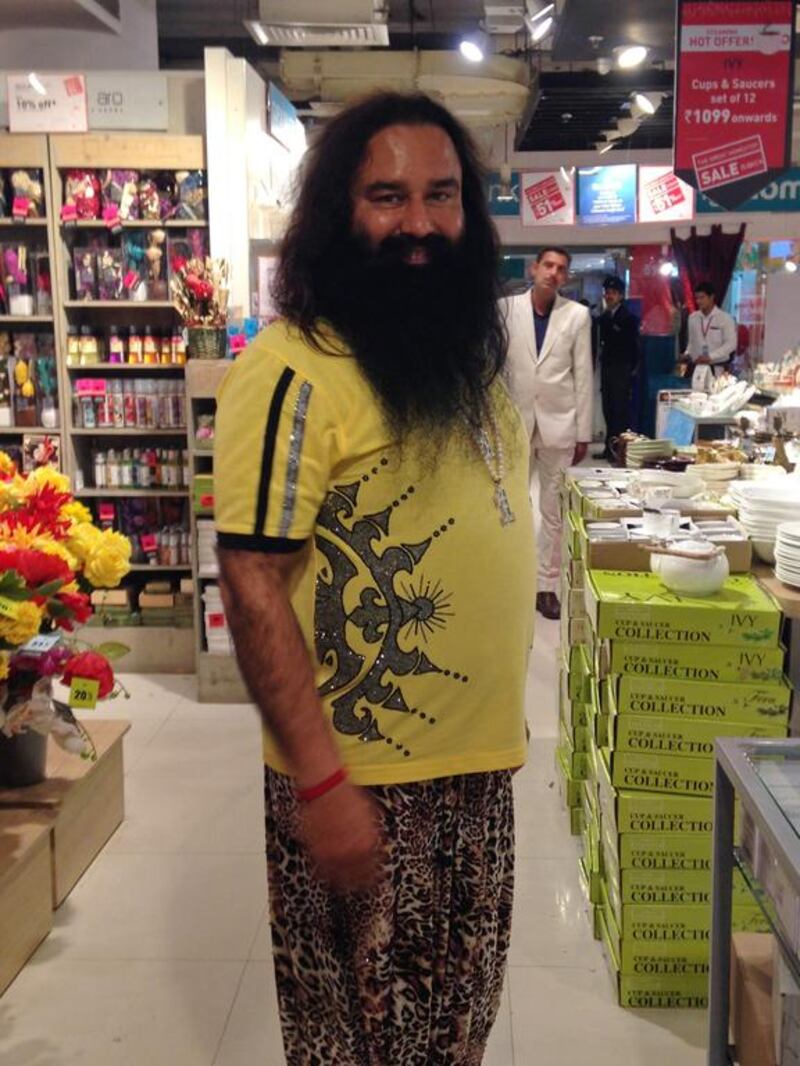 Indian spiritual guru Gurmeet Ram Rahim poses for a photograph after he was spotted shopping in New Delhi on January 5, 2015. Indian police said they are investigating a popular self-styled godman for allegedly encouraging 400 followers to undergo castrations at his ashram so they could get closer to god. Chandan Khanna / AFP Photo


