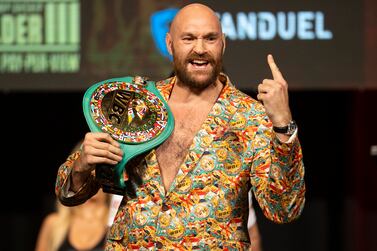 Tyson Fury poses during a news conference in advance of his heavyweight title boxing bout against Deontay Wilder, in Las Vegas on Wednesday, Oct.  6, 2021.  (Erik Verduzco / Las Vegas Review-Journal via AP)
