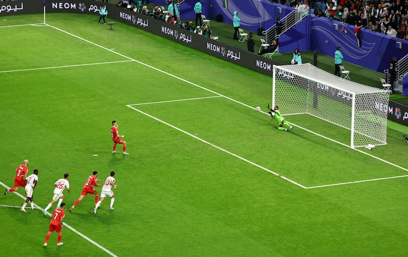 Palestine's Tamer Seyam sees penalty saved by UAE goalkeeper Khalid Essa. Reuters