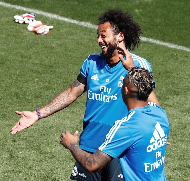 Real Madrid defender Marcelo shares a joke during training. EPA