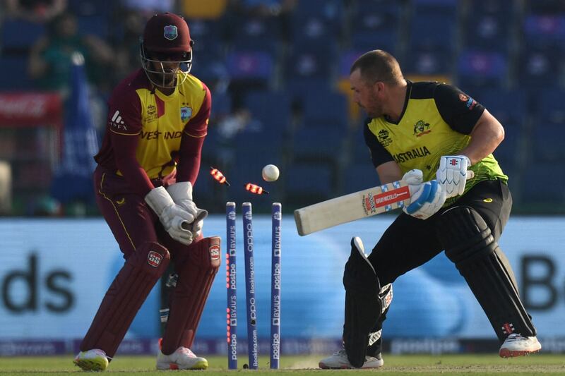 West Indies' wicketkeeper Nicholas Pooran watches after Australia's captain Aaron Finch is  bowled by Akeal Hosein. AFP