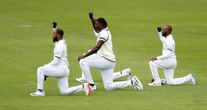 John Campbell, Jason Holder and Jermaine Blackwood of the West Indies take a knee is support of the Black Lives Matter movement on Wednesday. Getty