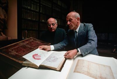 Scholars at the Bibleoteca Ambrosiana in Milan, Italy examine geometric designs in the 1200 page Codex Atlanticus of Leonard da Vinci. | Location: Bibleoteca Ambrosiana, Milan, Italy.  (Photo by James L. Amos/Corbis via Getty Images)