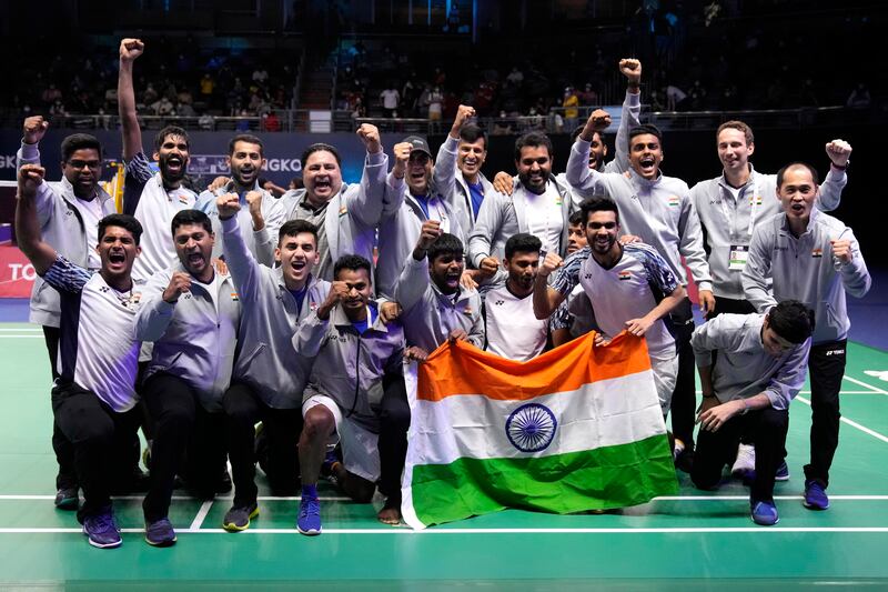 India's team members pose after winning Thomas Cup badminton title in Bangkok on Sunday, May 15, 2022. AP