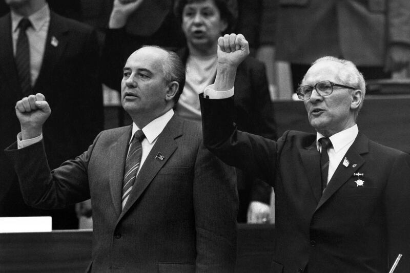 Gorbachev and East German communist leader Erich Honecker sing the 'The International', widely regarded as a communist anthem, in East Berlin in April 1986. AFP
